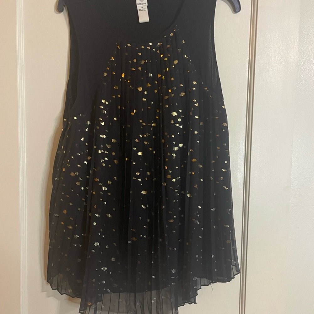 A.moon black tank with gold.  Good condition size medium.